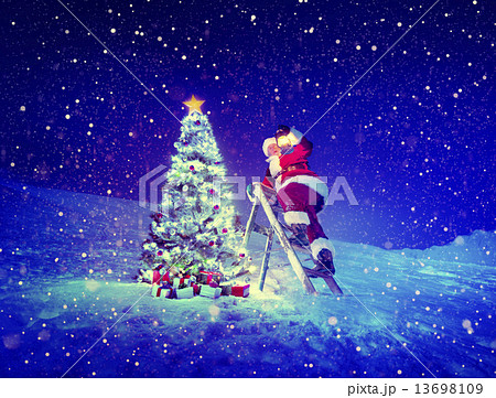 Santa with Lamp on a Step-Ladder by the Christmas Tree 13698109