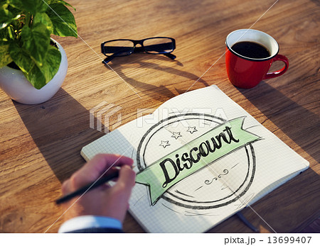 Businessman Writing the Word "Discount" Businessman Writing the Word "Discount" 13699407