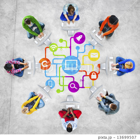 Diverse People Using Computers with Social Media Symbols 13699507