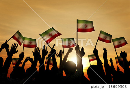 Silhouettes of People Waving the Flag of Iran 13699508
