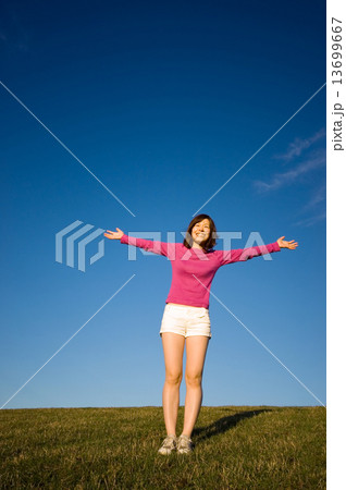 Young Woman With Her Arms Raised 13699667