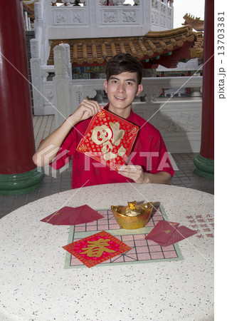 Man holding new year greetings Man holding new year greetings 13703381