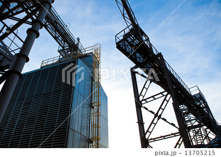 Towers of grain drying enterprise at sunny day 13705215