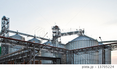 Towers of grain drying enterprise at sunny day Towers of grain drying enterprise at sunny day 13705224