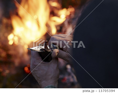 Dried reindeer meat and camp fire 13705394