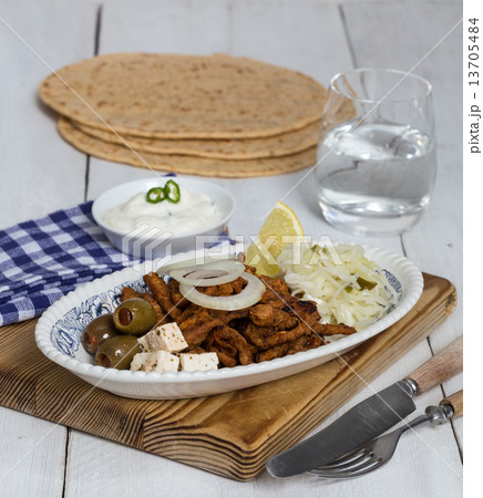 Gyros with Tzatziki Coleslaw olives and feta cheese Gyros with Tzatziki Coleslaw olives and feta cheese 13705484
