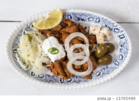 Gyros with Tzatziki Coleslaw olives and feta cheese Gyros with Tzatziki Coleslaw olives and feta cheese 13705490