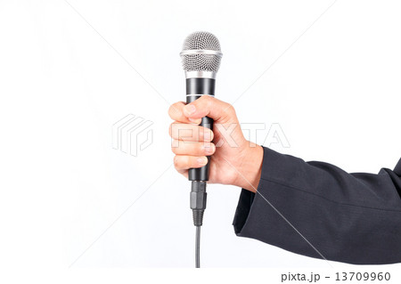 Business man holding a microphone isolated on white background 13709960