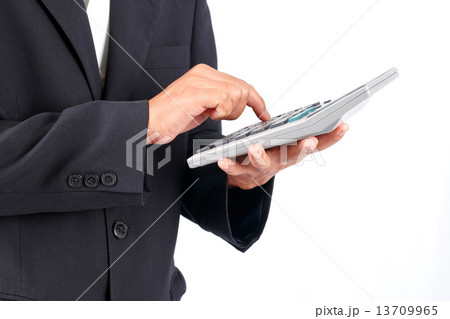 Businessman working with calculator 13709965