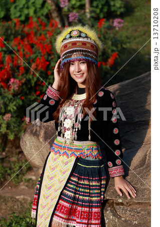 Traditionally dressed Mhong hill tribe woman in the garden Traditionally dressed Mhong hill tribe woman in the garden 13710208