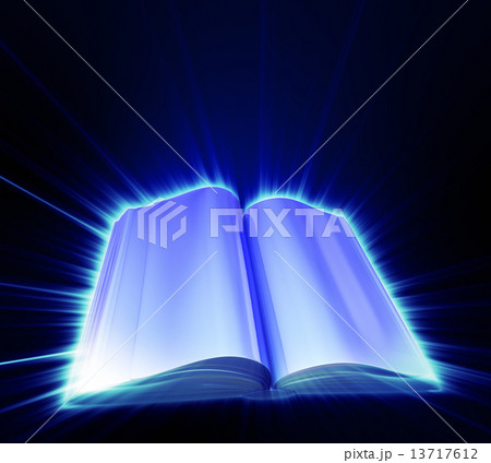 Opened book on black background and with blue glow 13717612