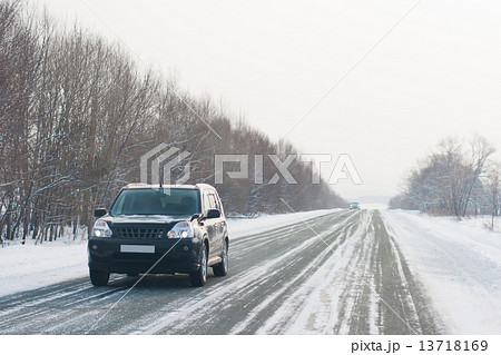 Car on a winter road Car on a winter road 13718169