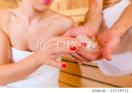 Couple sitting in wellness spa sauna Couple sitting in wellness spa sauna 13719511