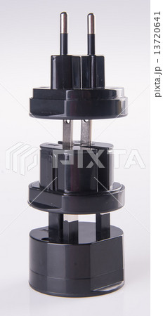 Travel plug adapter on a background Travel plug adapter on a background 13720641