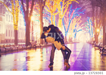 Couple kissing at night alley. Couple kissing at night alley. 13728301