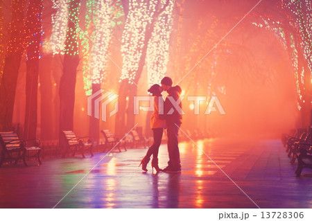Couple kissing at night alley. Couple kissing at night alley. 13728306