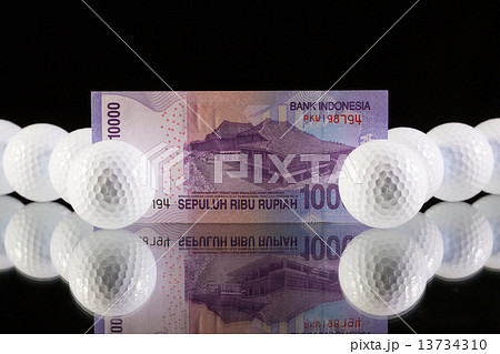Indonesia money on the black glass desk Indonesia money on the black glass desk 13734310
