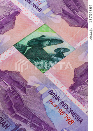 Different Indonesian rupiah banknotes on the table 13734364