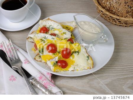 Scrambled eggs with tomatoes 13745674