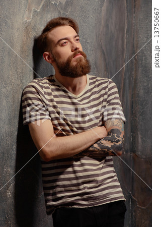 Young creative man posing on dark background Young creative man posing on dark background 13750667