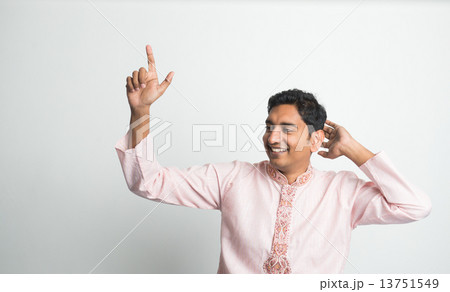 Indian in traditional clothes in dancing pose 13751549