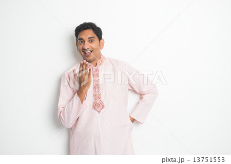 Indian in traditional clothes in dancing pose 13751553