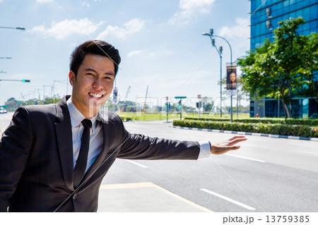 Asian man hailing cab Asian man hailing cab 13759385