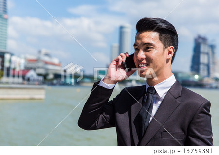 Asian man on phone Asian man on phone 13759391