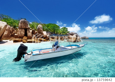 speed boat on the beach of Coco Island, Seychelles 13759642