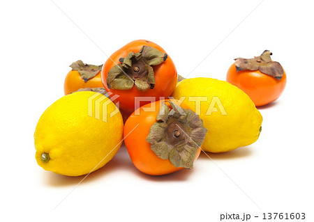 persimmon and lemon isolated on a white background close-up 13761603