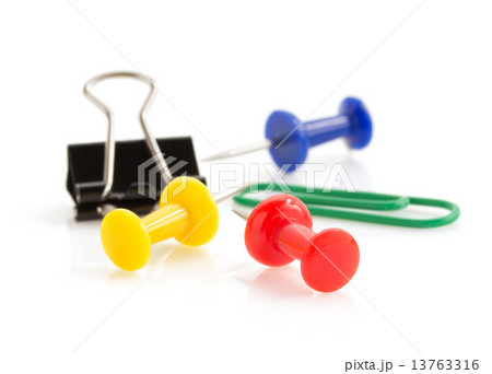 pushpin and paper clip on white background 13763316