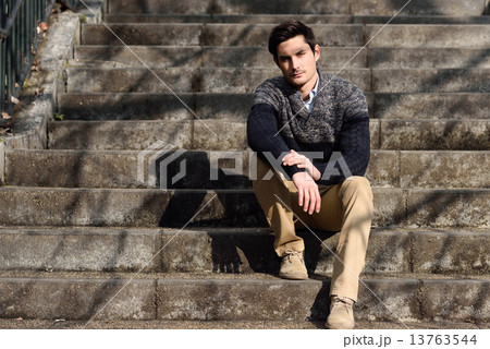 Attractive young handsome man, model of fashion in urban backgro Attractive young handsome man, model of fashion in urban backgro 13763544