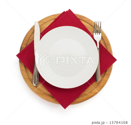 plate with napkin at cutting board  on white 13764108