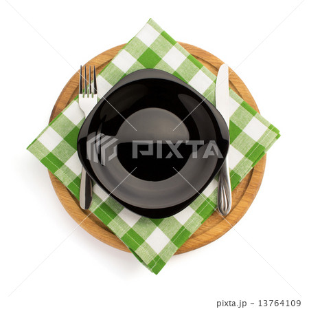 plate with napkin at cutting board 13764109
