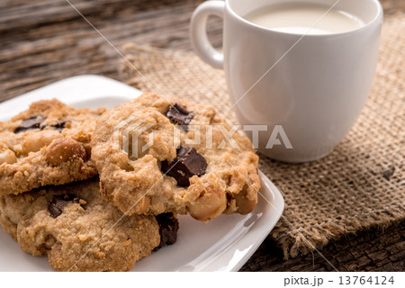 Stack of Chocolate chip cookie and glass of milk Stack of Chocolate chip cookie and glass of milk 13764124