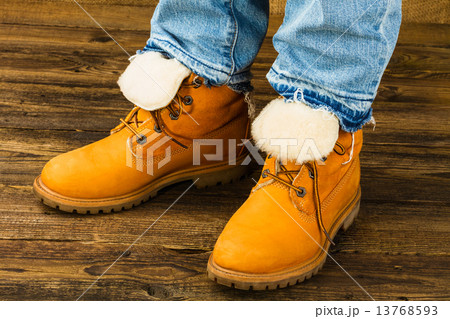 female feet in winter boots and jeans 13768593