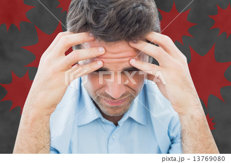 Composite image of man with headache 13769080