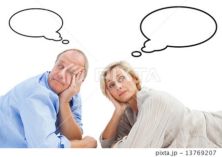 Composite image of mature couple lying and thinking 13769207