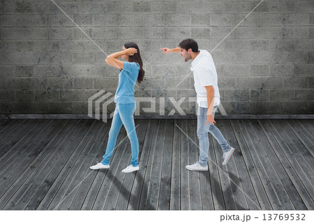 Composite image of angry boyfriend shouting at girlfriend Composite image of angry boyfriend shouting at girlfriend 13769532