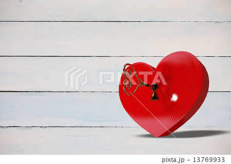 Bright red heart shaped lock with key 13769933