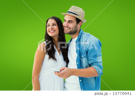 Composite image of happy hipster couple smiling together 13770041