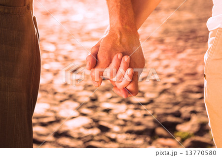 Happy senior couple holding hands Happy senior couple holding hands 13770580