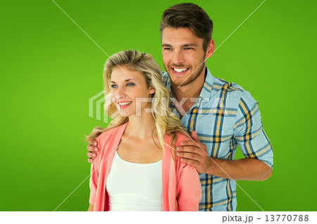 Composite image of attractive young couple smiling together Composite image of attractive young couple smiling together 13770788