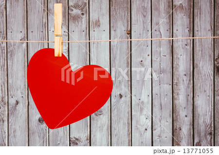 A heart hanging on a line 13771055