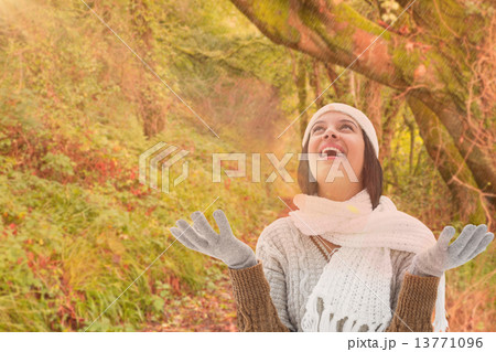 Composite image of brunette in warm clothing Composite image of brunette in warm clothing 13771096