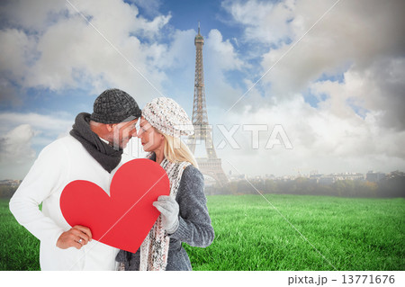 Composite image of smiling couple in winter fashion posing with Composite image of smiling couple in winter fashion posing with 13771676