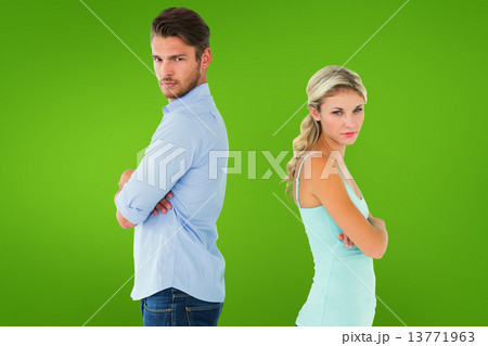 Composite image of unhappy couple not speaking to each other Composite image of unhappy couple not speaking to each other 13771963