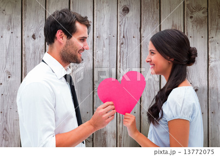 Composite image of pretty brunette giving boyfriend her heart Composite image of pretty brunette giving boyfriend her heart 13772075