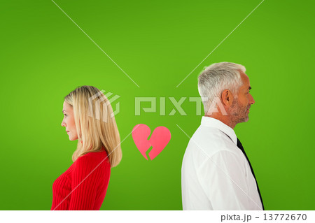 Composite image of couple not talking with broken heart between 13772670
