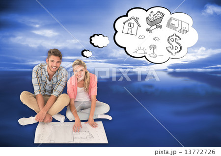 Composite image of attractive young couple sitting looking at bl Composite image of attractive young couple sitting looking at bl 13772726